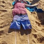 silly pictures of skinny legs buried in sand